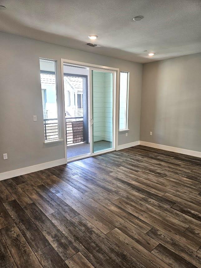 122 Ranch Lane Mountain View, CA 94040 - Photo 8 of 20 wooden floor in an empty room with a window