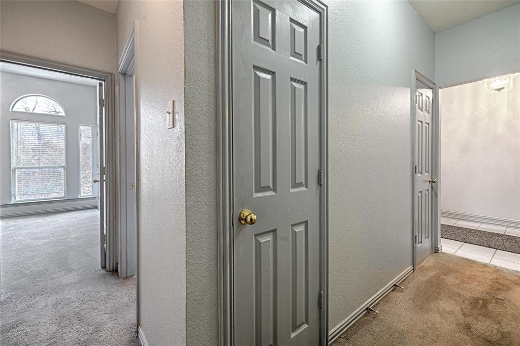 400 Dale Hollow Road Fort Worth, TX 76103 - Photo 15 of 29 a view of a hallway with wooden floor and closet