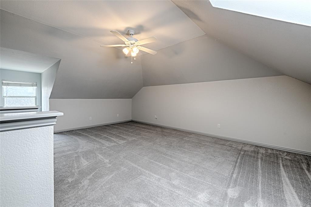 400 Dale Hollow Road Fort Worth, TX 76103 - Photo 22 of 29 wooden floor in an empty room with a window