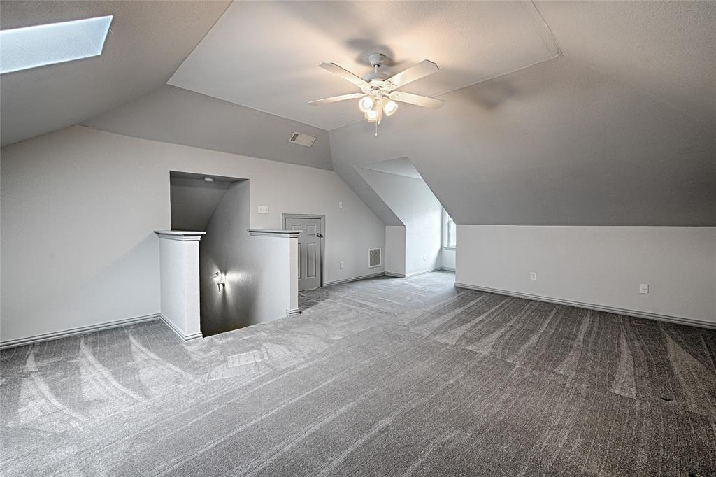 400 Dale Hollow Road Fort Worth, TX 76103 - Photo 23 of 29 a view of empty room with a ceiling fan and window