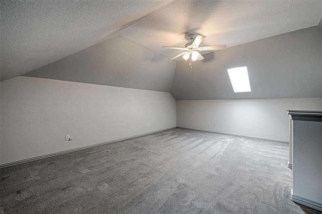 400 Dale Hollow Road Fort Worth, TX 76103 - Photo 24 of 29 an empty room with a window and a fan