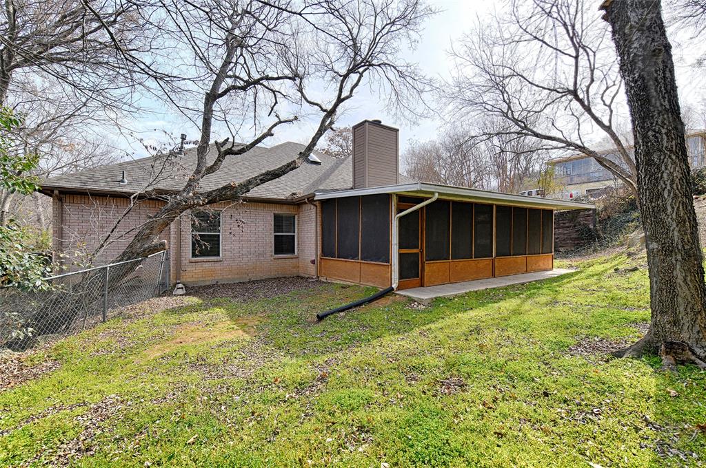400 Dale Hollow Road Fort Worth, TX 76103 - Photo 28 of 29 a view of a house with a yard