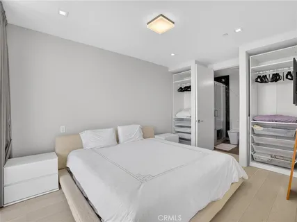 a bedroom with a bed and a closet