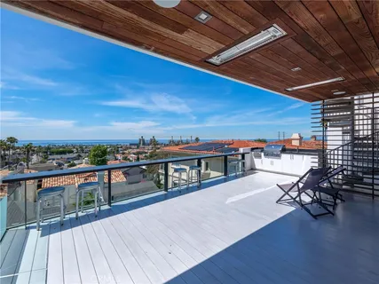 a view of a chairs and table on the deck