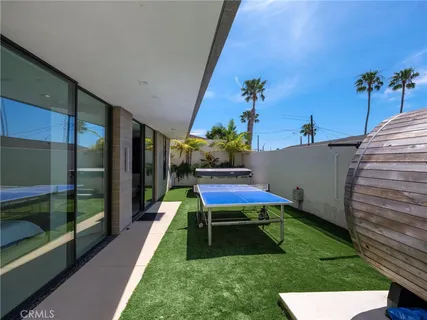 a patio with table and chairs
