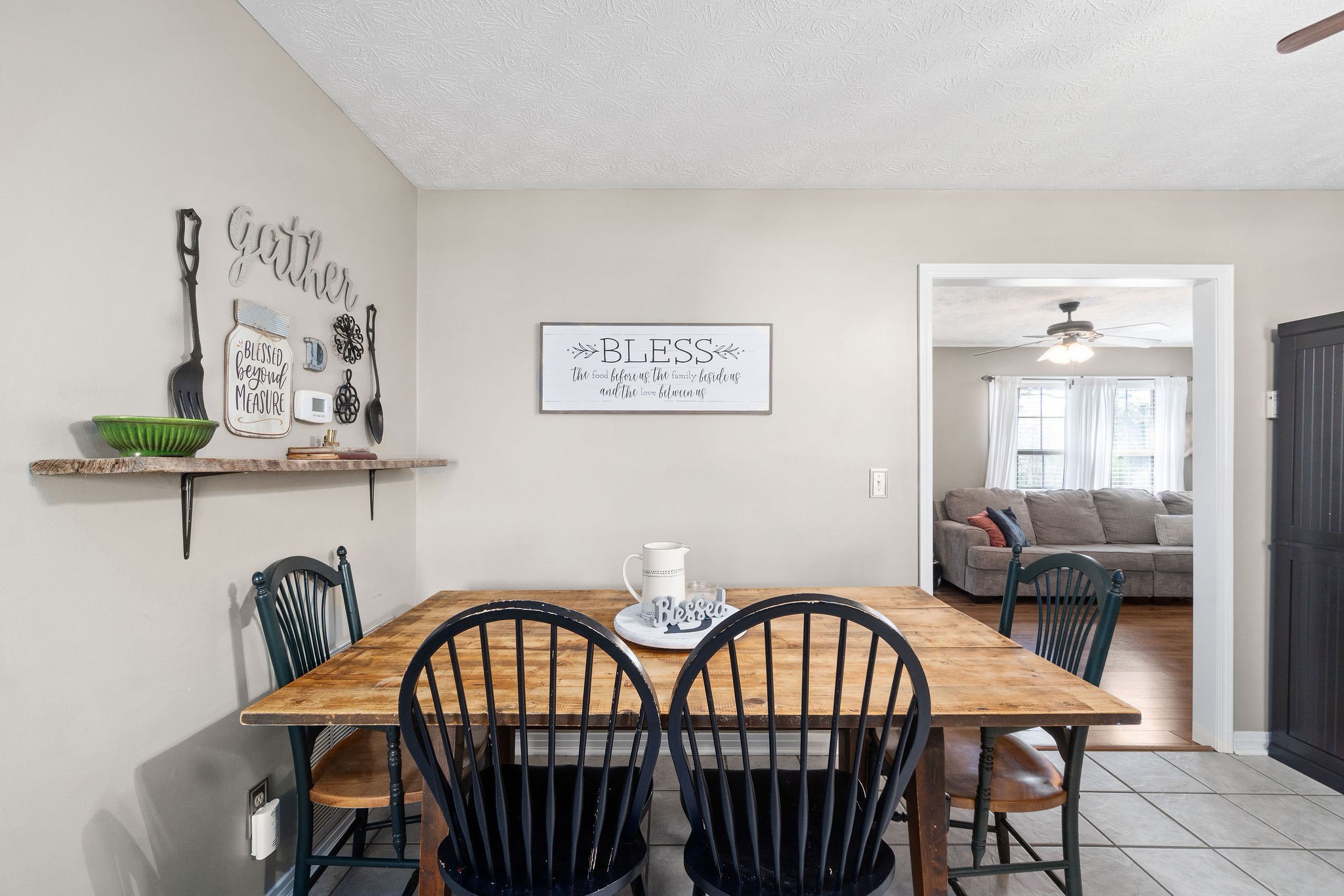 2868 Waverly Road Tennessee Ridge, TN 37178 - Photo 12 of 33 a view of a dining room that has a table and chairs
