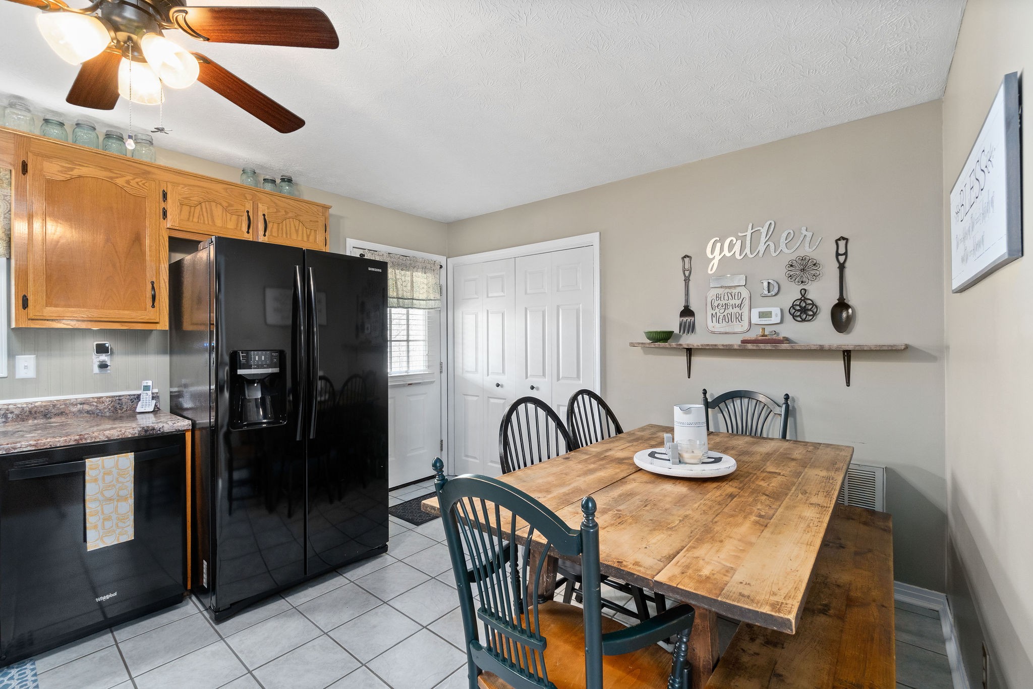 2868 Waverly Road Tennessee Ridge, TN 37178 - Photo 14 of 33 a kitchen with granite countertop a refrigerator and a stove top oven