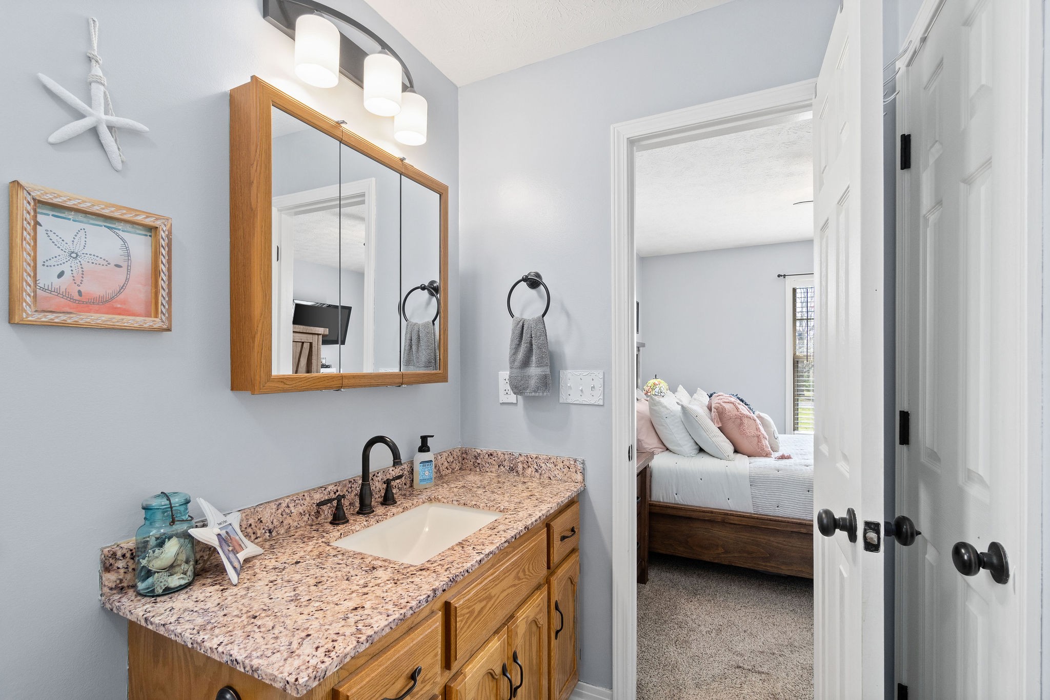 2868 Waverly Road Tennessee Ridge, TN 37178 - Photo 21 of 33 a bedroom with a bed and a mirror