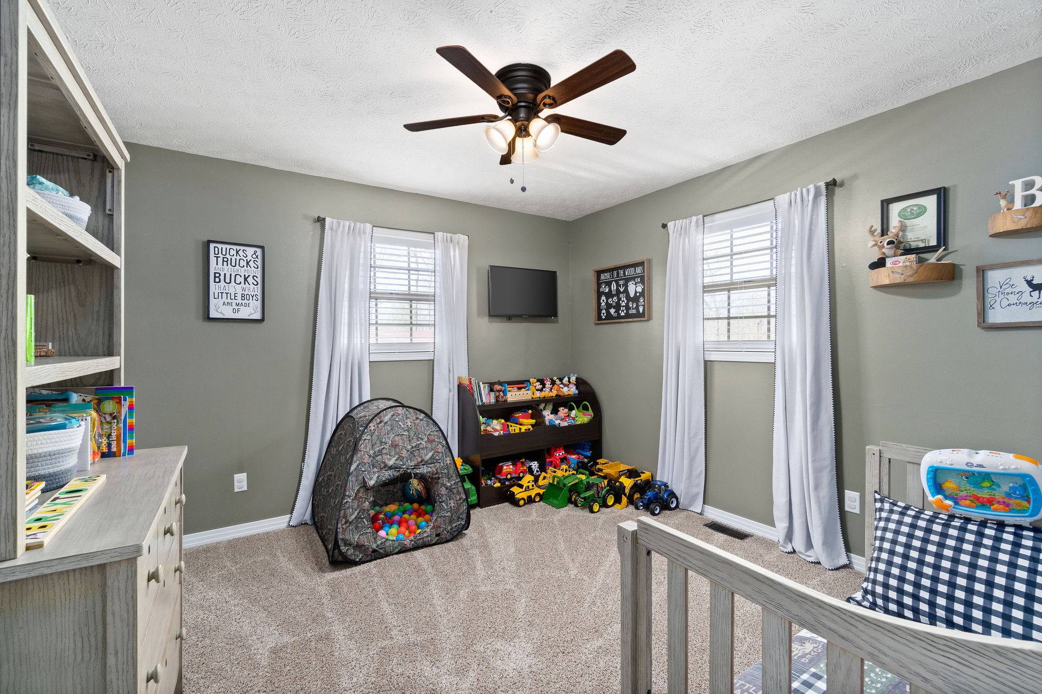 2868 Waverly Road Tennessee Ridge, TN 37178 - Photo 22 of 33 a bedroom with furniture and a chandelier