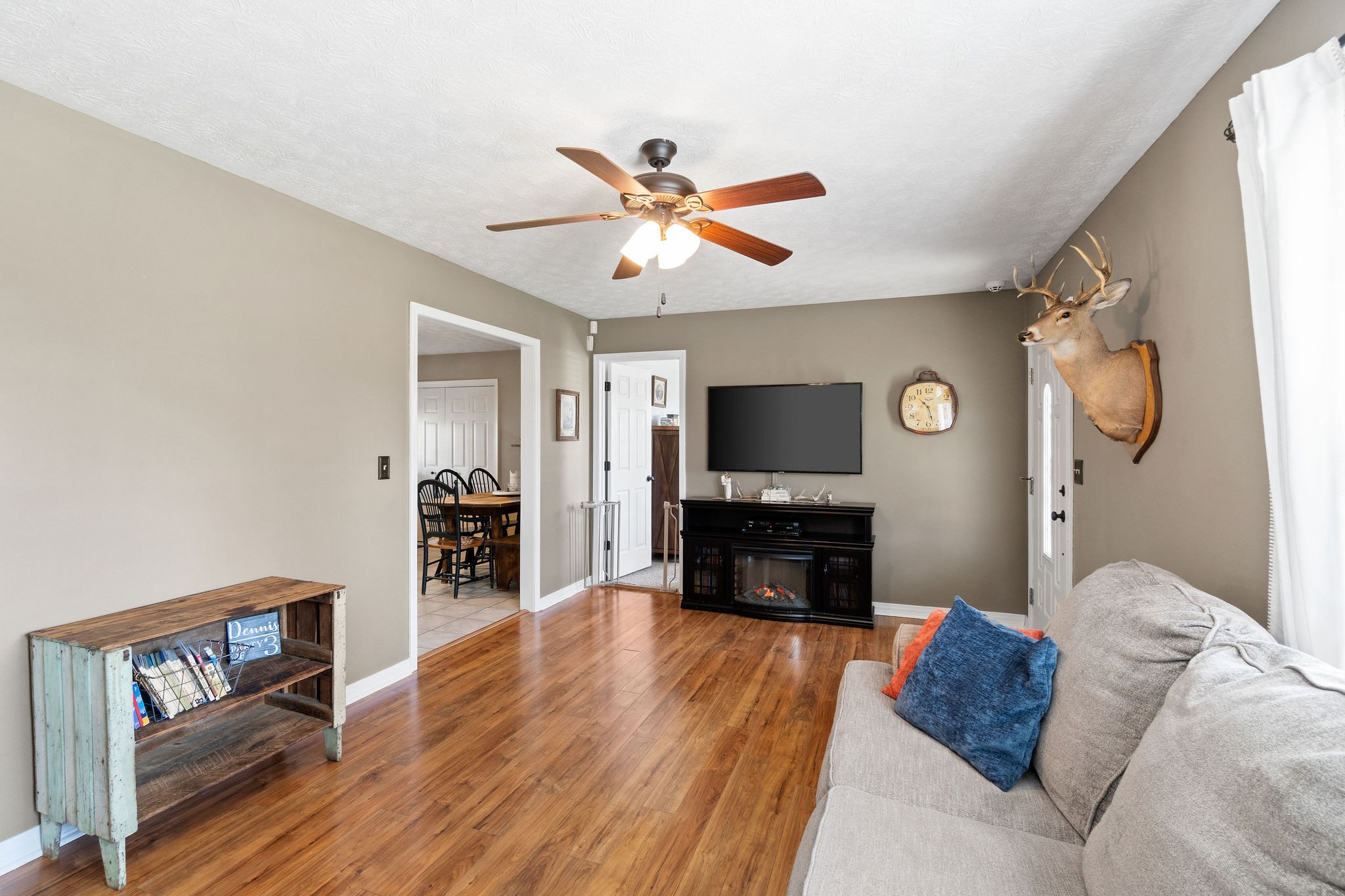 2868 Waverly Road Tennessee Ridge, TN 37178 - Photo 7 of 33 a living room with furniture a fireplace and a flat screen tv