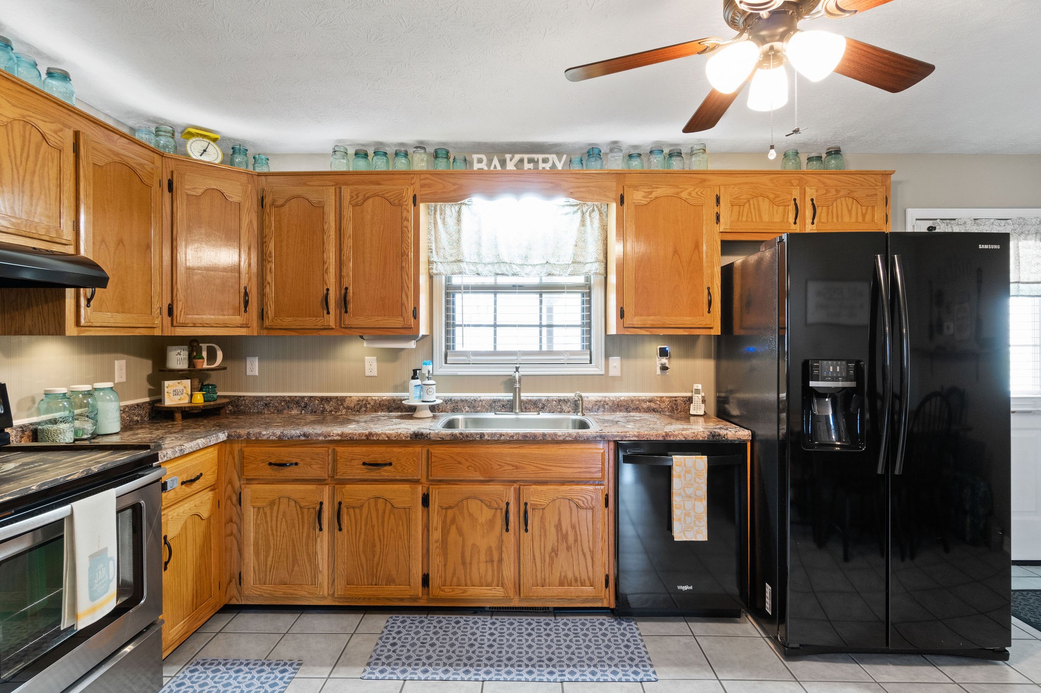 2868 Waverly Road Tennessee Ridge, TN 37178 - Photo 9 of 33 a kitchen with stainless steel appliances granite countertop a stove a refrigerator and a microwave