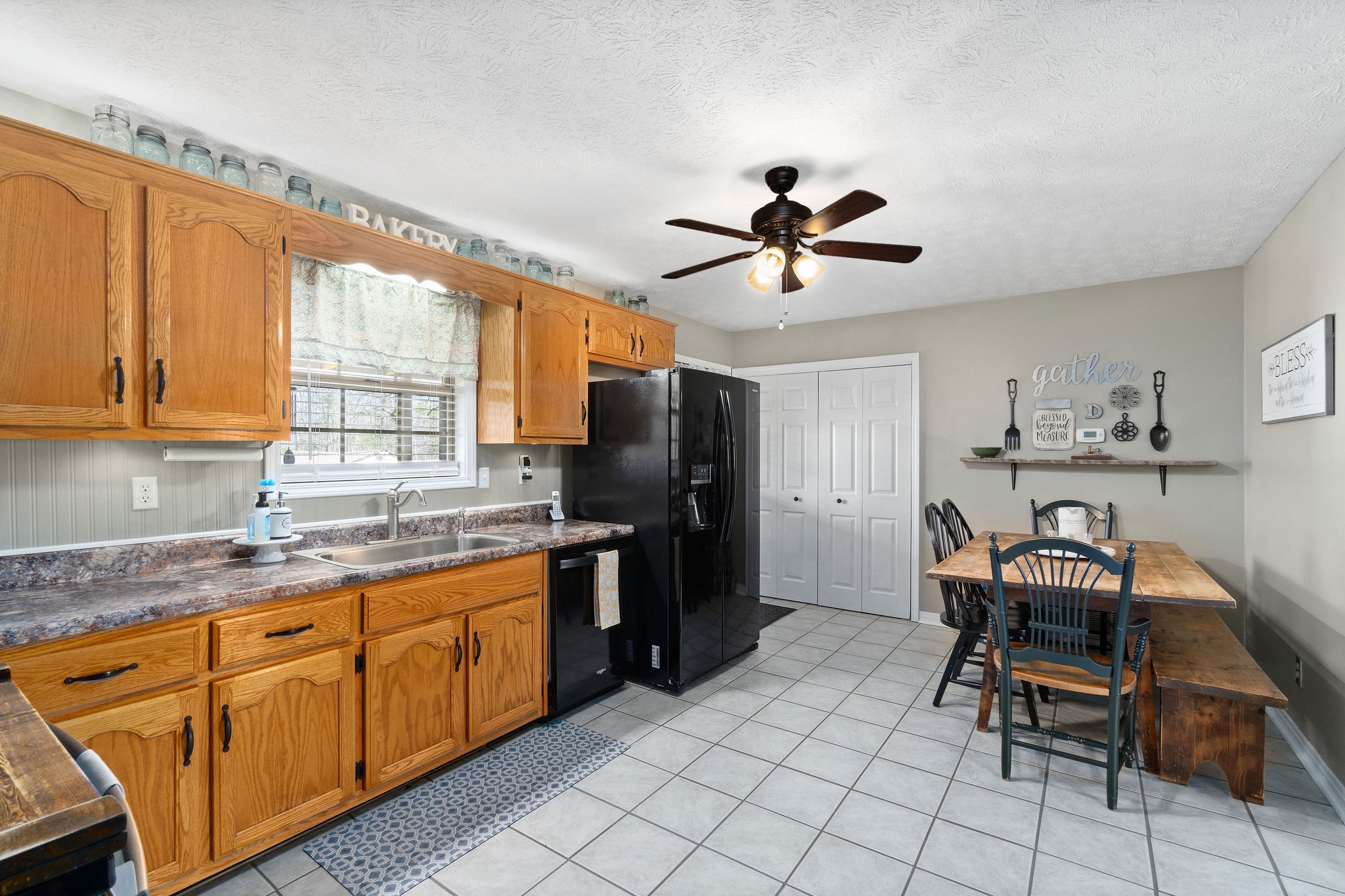 2868 Waverly Road Tennessee Ridge, TN 37178 - Photo 10 of 33 a kitchen with stainless steel appliances granite countertop a sink and a refrigerator