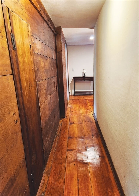 164 Worcester Road Westminster, MA 01473 - Photo 24 of 39 a hallway with wooden floor and a potted plant
