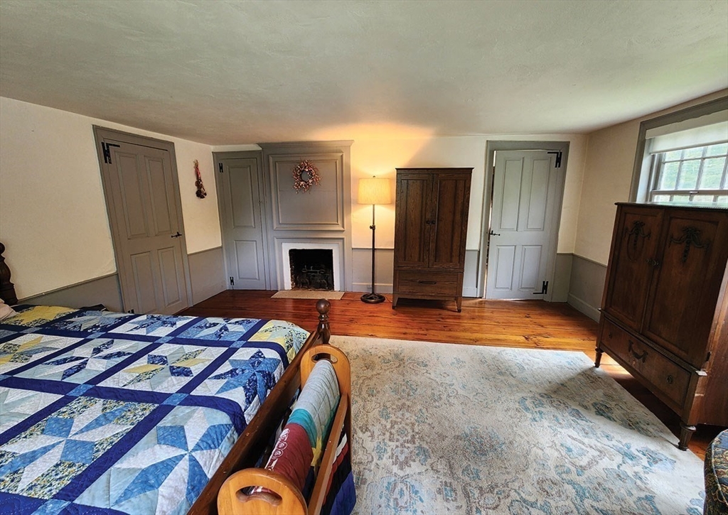 164 Worcester Road Westminster, MA 01473 - Photo 26 of 39 a bed sitting in a room next to a window
