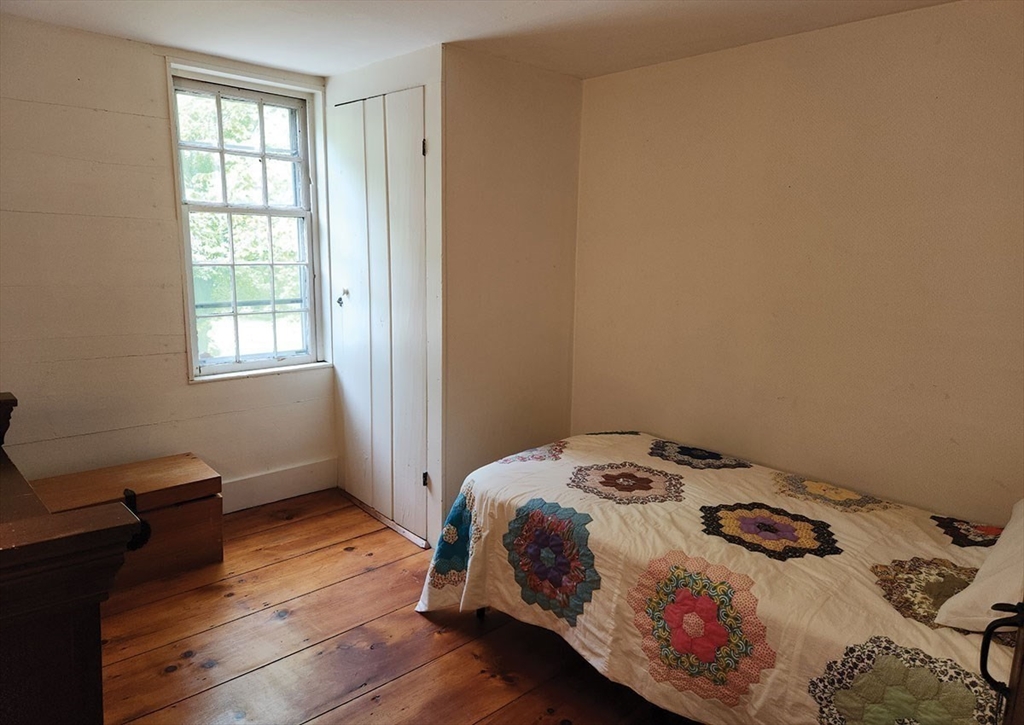 164 Worcester Road Westminster, MA 01473 - Photo 28 of 39 a bedroom with a bed and wooden floor
