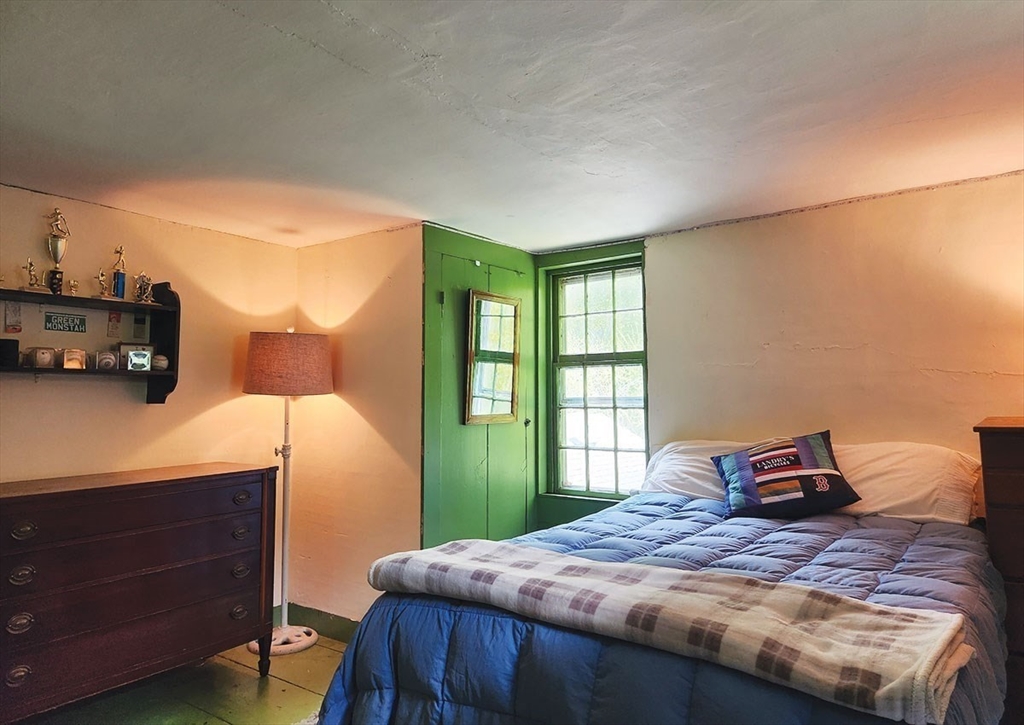 164 Worcester Road Westminster, MA 01473 - Photo 29 of 39 a bedroom with a bed and wooden floor