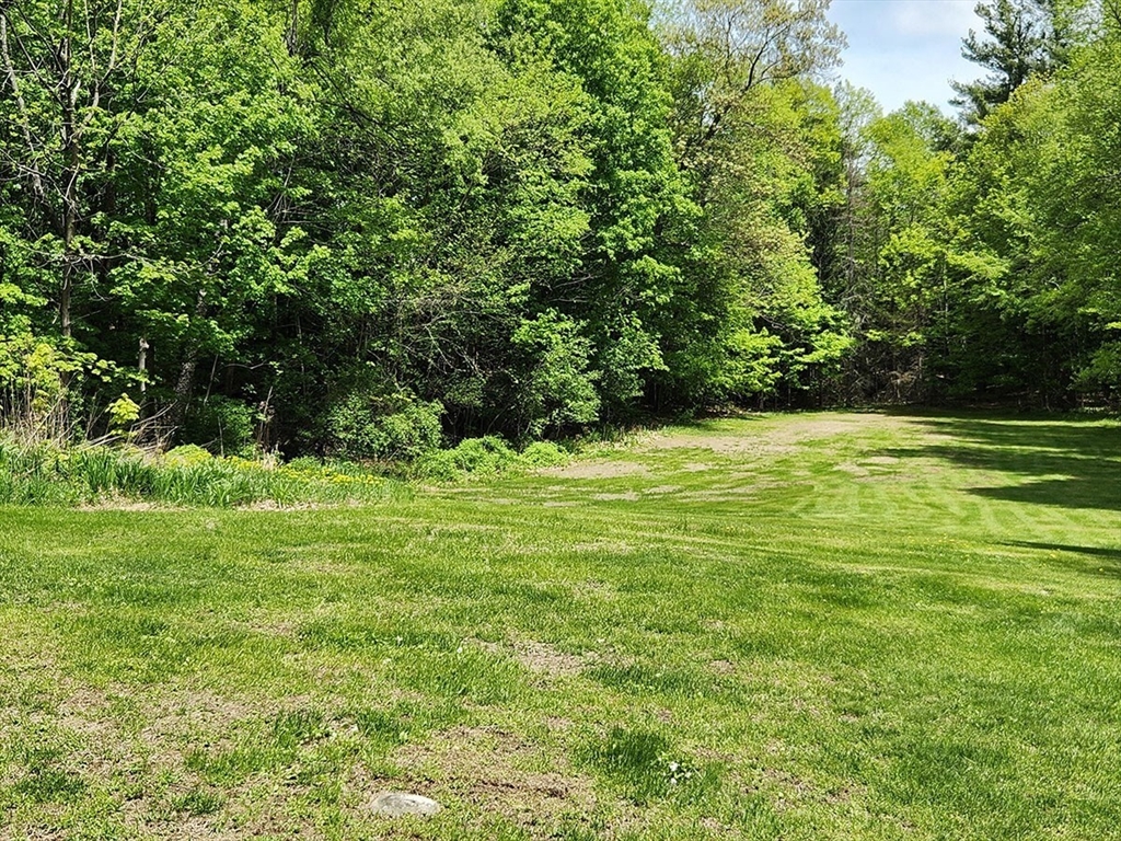 164 Worcester Road Westminster, MA 01473 - Photo 37 of 39 a view of a field with a trees in the background