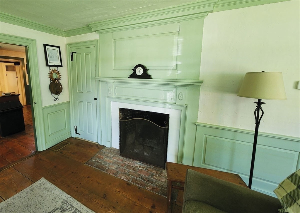 164 Worcester Road Westminster, MA 01473 - Photo 9 of 39 a living room with a fireplace and a walk in closet