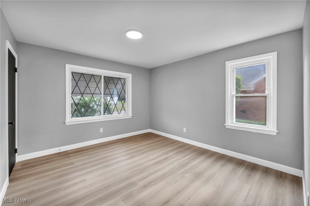 20202 Sumpter Road Cleveland, OH 44128 - Photo 15 of 46 Unfurnished bedroom featuring light wood finished floors and a closet