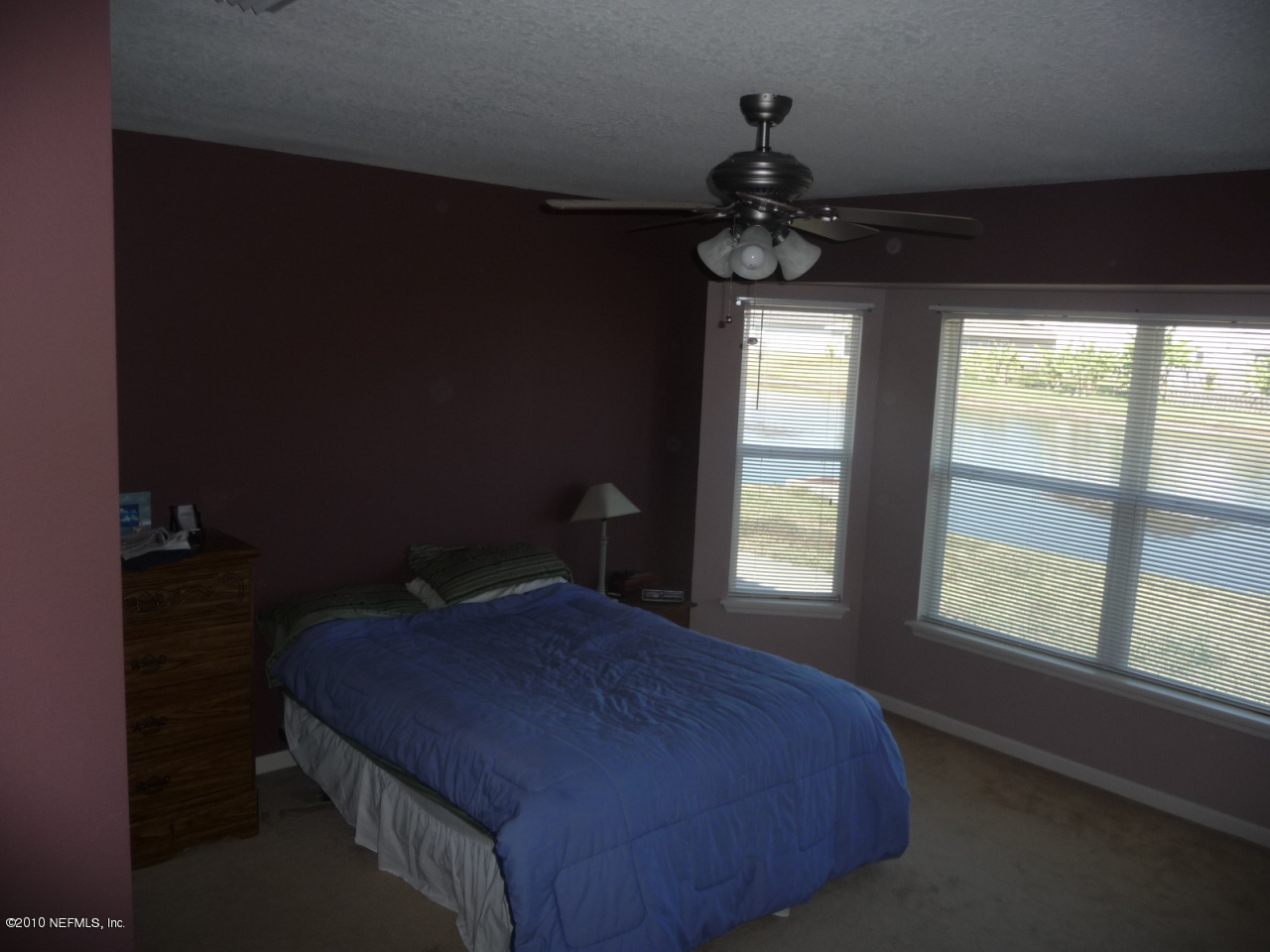 1044 Morning Light Road Jacksonville, FL 32218 - Photo 9 of 23 a bedroom with a bed and a window