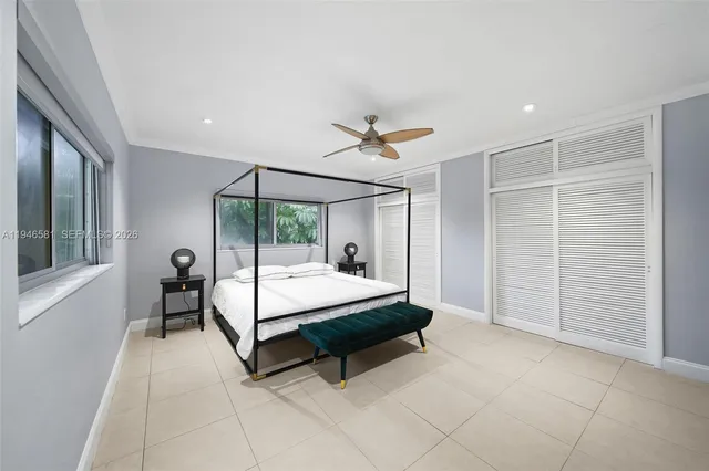 a bed room with a bed and a window