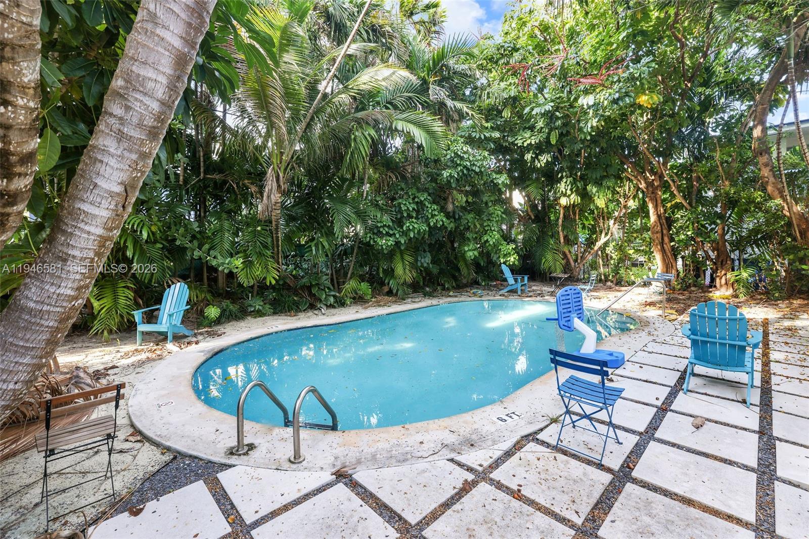 1145 101st Street, Unit 4 Bay Harbor Islands, FL 33154 - Photo 22 of 22 a view of a swimming pool with a patio