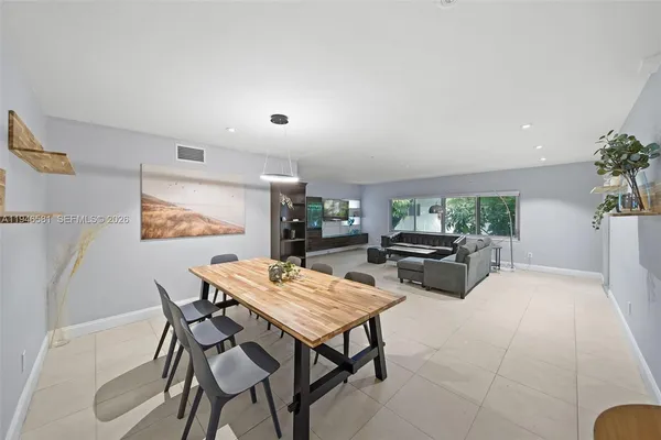 a living room with furniture and a table