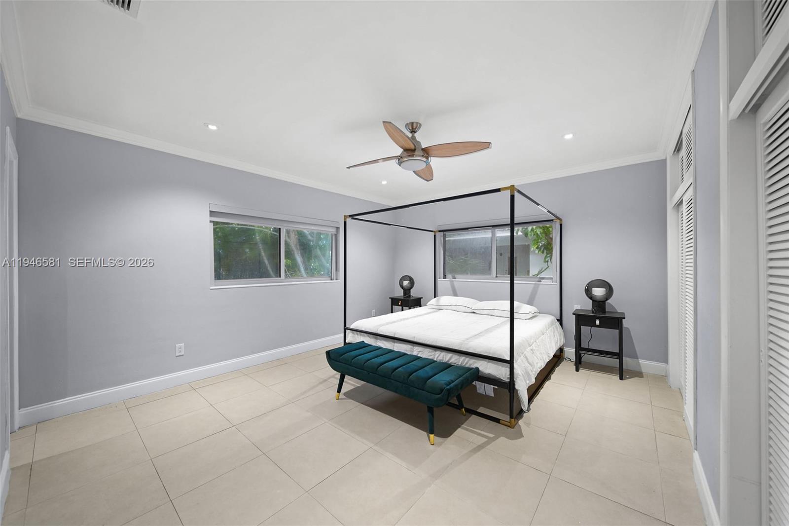 1145 101st Street, Unit 4 Bay Harbor Islands, FL 33154 - Photo 9 of 22 a bed room with a bed and a window