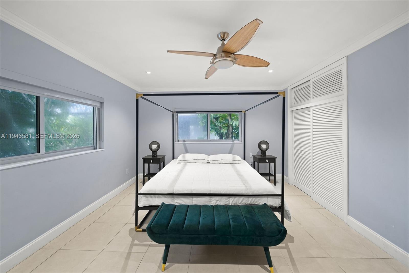 1145 101st Street, Unit 4 Bay Harbor Islands, FL 33154 - Photo 10 of 22 a living room with a bed furniture and a window