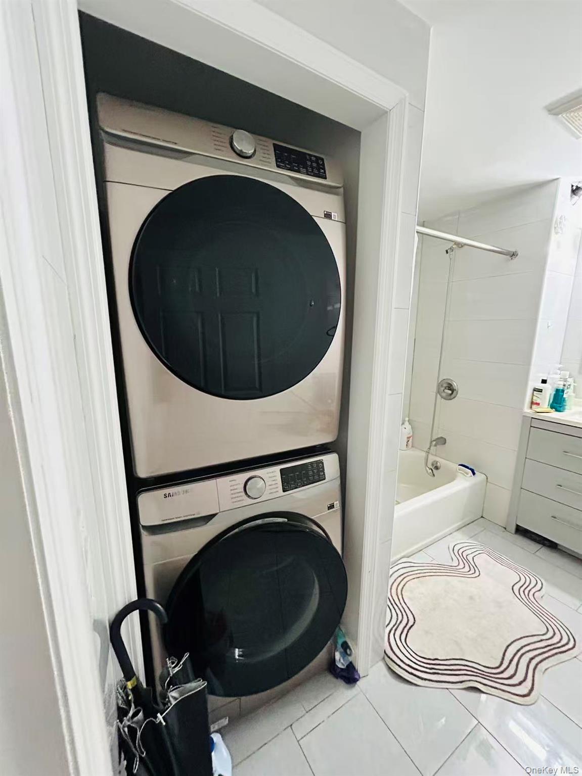 132-16 Maple Avenue, Unit 3A Queens, NY 11355 - Photo 10 of 10 a utility room with dryer and washer