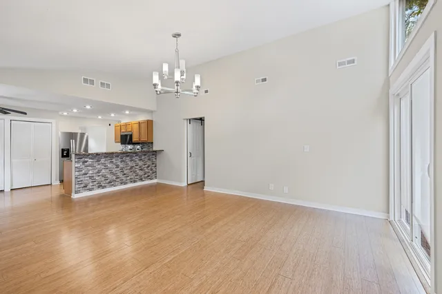 a view of a livingroom with a furniture wooden floor and window
