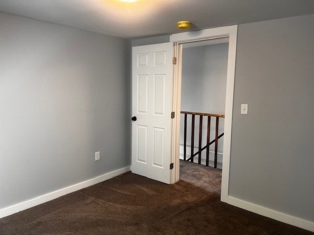 1 Madison Street, Unit B Amesbury, MA 01913 - Photo 11 of 17 an empty room with wooden floor and windows