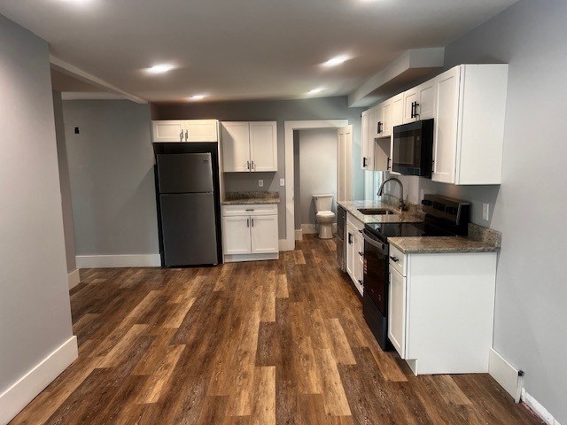 1 Madison Street, Unit B Amesbury, MA 01913 - Photo 3 of 17 a kitchen with refrigerator and microwave
