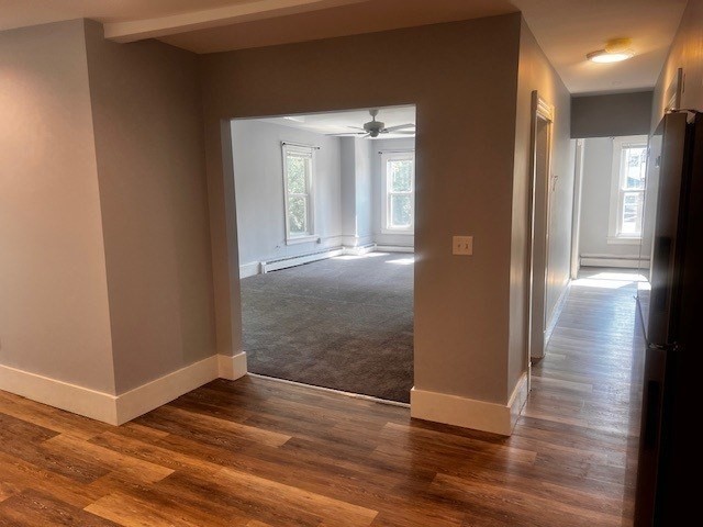 1 Madison Street, Unit B Amesbury, MA 01913 - Photo 6 of 17 a view of a hallway with wooden floor