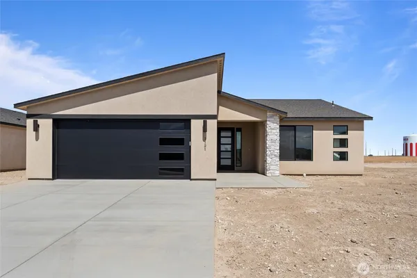 a front view of a house with a outdoor space
