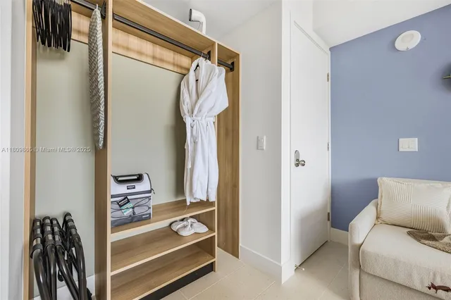 a view of a workspace with furniture and a gate