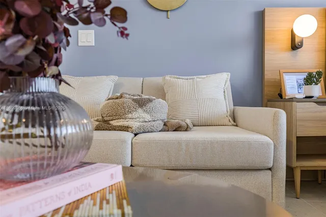 a bedroom with a bed and a chair