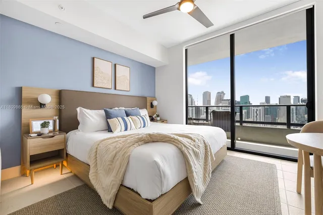 a view of a chairs and table in the balcony