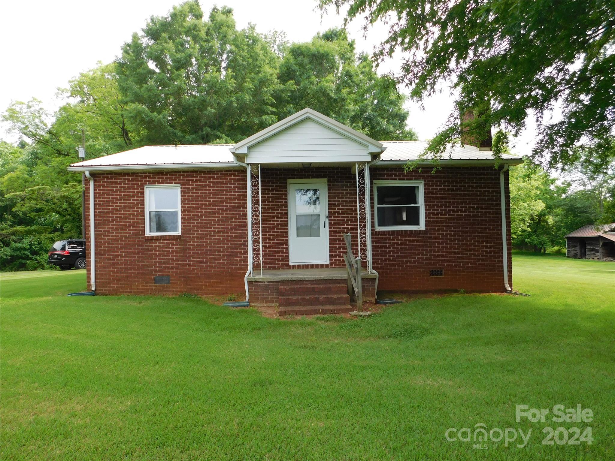 175 Fairmount Road Statesville, NC 28625 - Photo 11 of 30 a front view of a house with garden