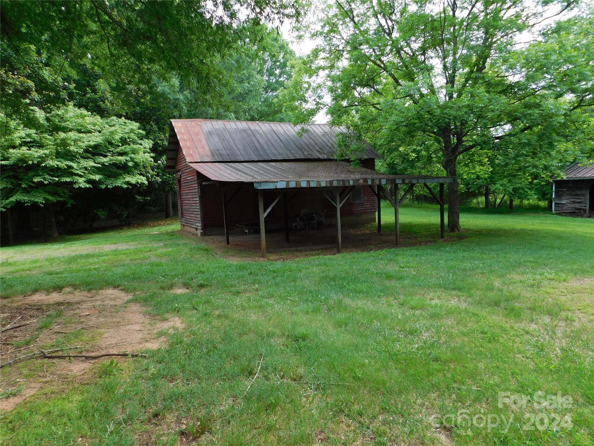 175 Fairmount Road Statesville, NC 28625 - Photo 16 of 30 a view of backyard with a garden and entertaining space
