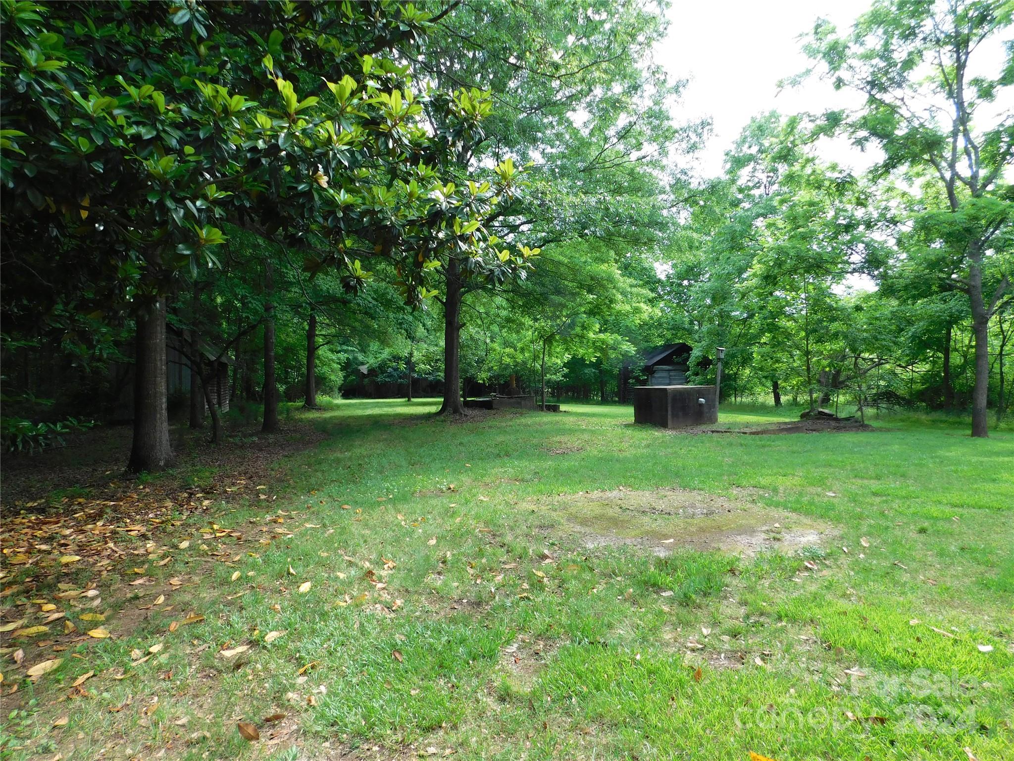 175 Fairmount Road Statesville, NC 28625 - Photo 17 of 30 a backyard of a house with lots of green space