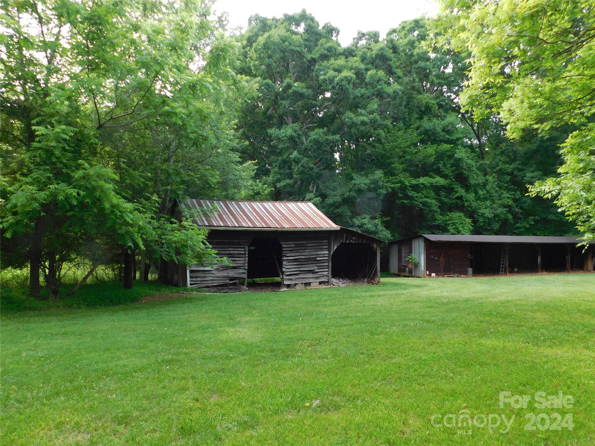 175 Fairmount Road Statesville, NC 28625 - Photo 18 of 30 a view of a house with a yard and sitting area