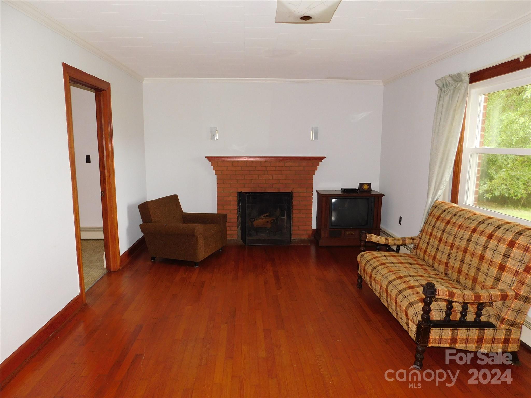175 Fairmount Road Statesville, NC 28625 - Photo 23 of 30 a living room with furniture and a fireplace