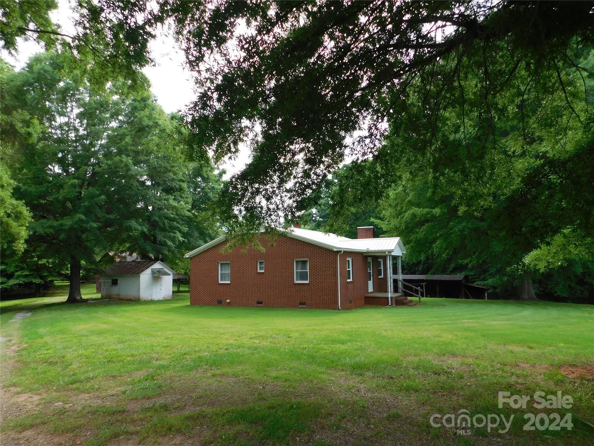 175 Fairmount Road Statesville, NC 28625 - Photo 10 of 30 a view of a house with a yard and a large tree