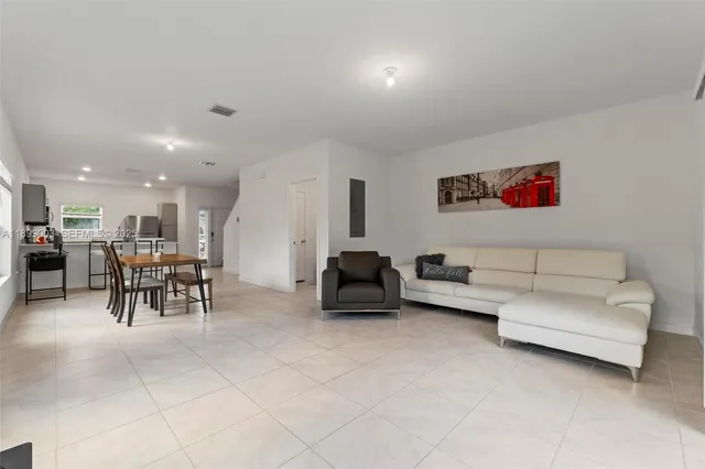 a living room with furniture and a table
