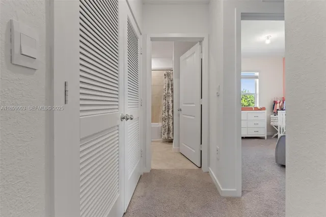 a view of a bedroom from a hallway