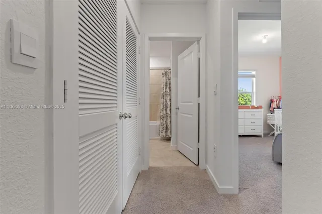 a view of a bedroom from a hallway