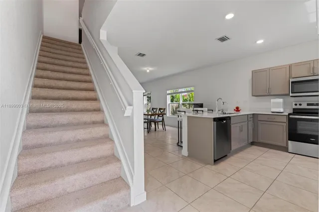 a kitchen with a cabinets and appliances