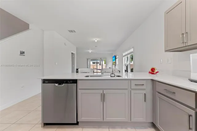 a kitchen with white cabinets