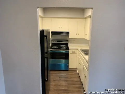 a view of a kitchen with a sink